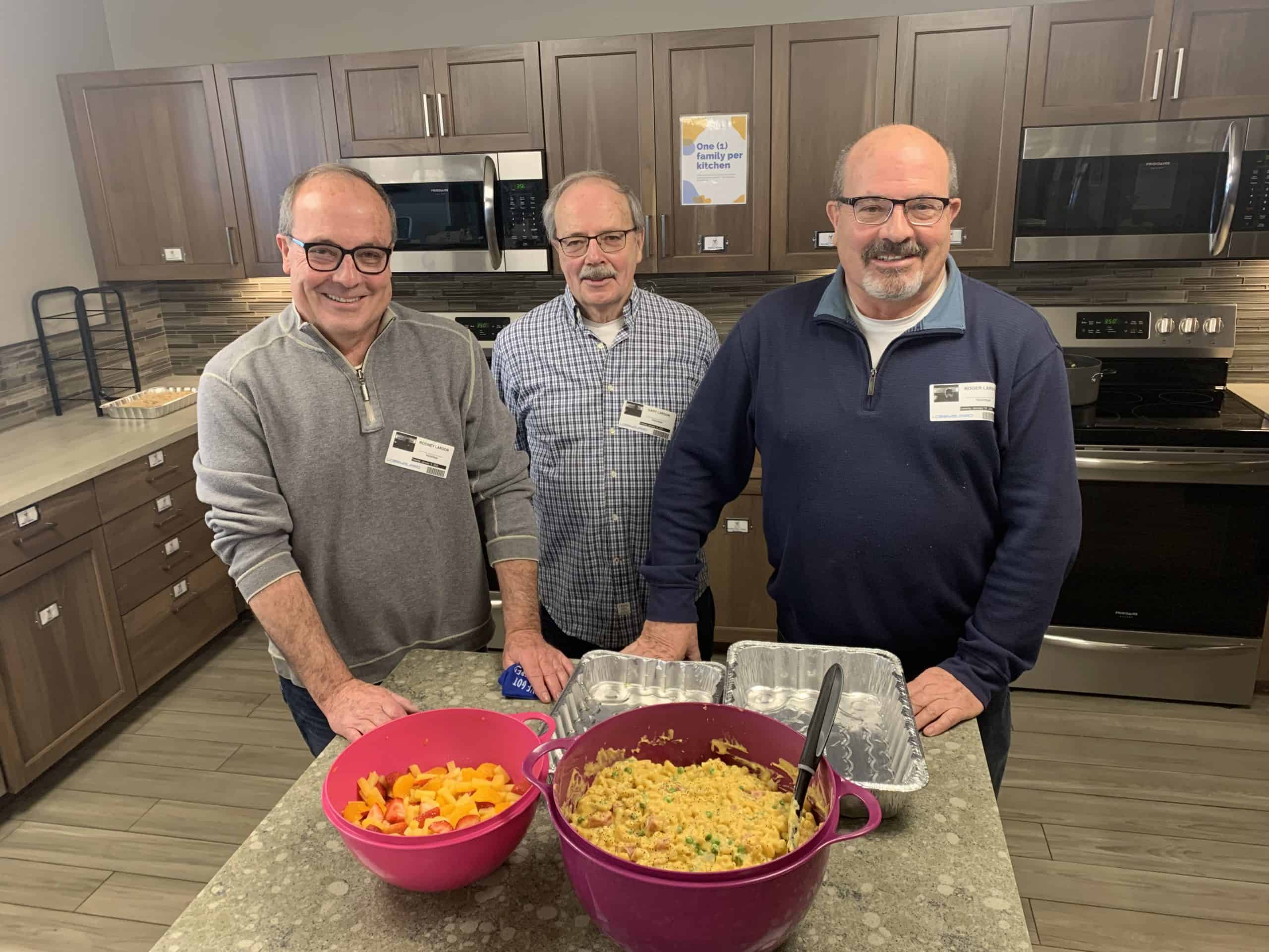 Three male volunteers in the kitchen of RMHC Fargo