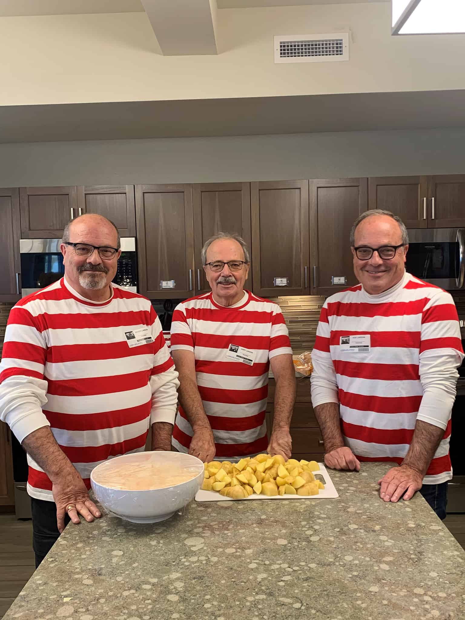 Larson brothers wearing striped shirts in House kitchen